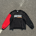Colorblock Tee in black and red, flat lay on concrete
